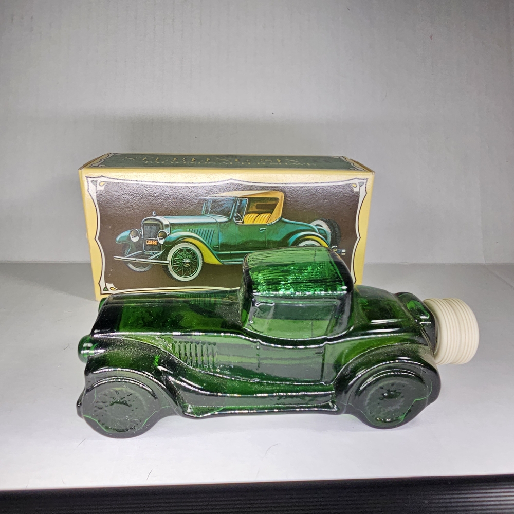 Avon Sterling Six II Green Glass Car Bottle